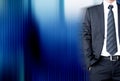 Businessman with suit & tie on dark blue abstract background