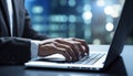 a businessman in a suit typing on a laptop, corporate sunset cityscape views in the background