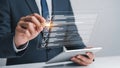 A businessman in a suit using a digital checklist on a tablet Royalty Free Stock Photo