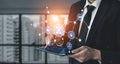 Businessman in Suit Using Tablet with Digital Connections and Technology Icons in Modern Office Environment for Data and Royalty Free Stock Photo
