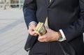 Businessman in a suit with a wad of cash. time to make money. Royalty Free Stock Photo