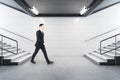 Businessman in suit walking in metro station