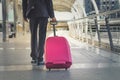Businessman and suitcase in the airport departure lounge , traveler suitcases in airport terminal,Travel concept Royalty Free Stock Photo