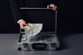 Businessman with suitcase full of money Royalty Free Stock Photo