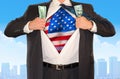 Businessman superhero clutching money and opening shirt to reveal United States of America flag Royalty Free Stock Photo