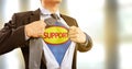 Businessman in superhero costume in help and support