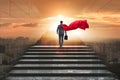 The businessman superhero successful in career ladder concept Royalty Free Stock Photo