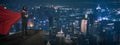 Businessman superhero wearing gas mask,protect virus or dust ,standing on building rooftop to looking cityscape at night,concept