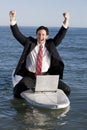 Businessman on Surfboard