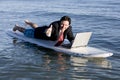 Businessman on Surfboard