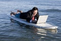 Businessman on Surfboard