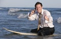 Businessman on Surfboard Royalty Free Stock Photo