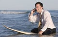 Businessman on Surfboard Royalty Free Stock Photo
