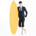 Businessman with surfboard and summer vacation Royalty Free Stock Photo