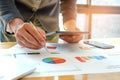 Businessman with a tablet is analyzing a graph. Royalty Free Stock Photo