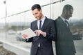 Businessman with tablet computer in office building Royalty Free Stock Photo