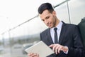 Businessman with tablet computer in office building Royalty Free Stock Photo