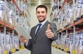 Businessman with tablet pc over warehouse Royalty Free Stock Photo