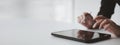 Businessman with a tablet, he uses the tablet to view business documents and communicate sending e-mail messages over the internet
