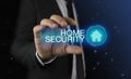 Businessman takes a hand home icon with inscription home security concept