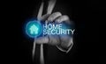 Businessman takes a hand home icon with inscription home security concept