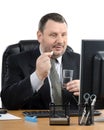 Businessman takes pill in front of monitor