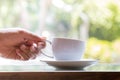 Businessman taking coffee cup for drinking in coffee cafe Royalty Free Stock Photo