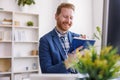 Businessman taking notes in planner while working in an office Royalty Free Stock Photo