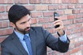 Businessman taking selfie picture with mobile phone Royalty Free Stock Photo