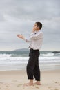 Businessman talking on cell phone on a beach Royalty Free Stock Photo