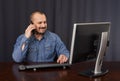 Businessman talking on cellphone while working Royalty Free Stock Photo