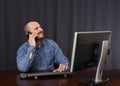Businessman talking on cellphone while working Royalty Free Stock Photo
