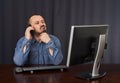 Businessman talking on cellphone while working Royalty Free Stock Photo