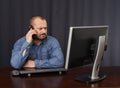 Businessman talking on cellphone while working Royalty Free Stock Photo