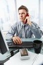 Businessman talking on landline phone in office Royalty Free Stock Photo