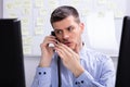 Businessman Talking On Landline Phone