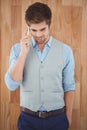Businessman talking on mobile phone standing in office Royalty Free Stock Photo