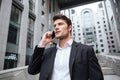 Businessman talking on mobile phone at the street Royalty Free Stock Photo