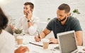 Businessman talking on a phone call. Young architect writing during a meeting. Businessmen in a meeting together