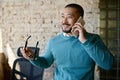 Businessman talking phone with client at coworking office Royalty Free Stock Photo