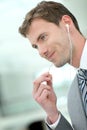 Businessman talking on phone with earphones