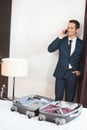 Businessman talking on phone in hotel room Royalty Free Stock Photo