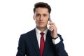 businessman talking on the phone and looking at camera Royalty Free Stock Photo