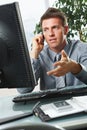 Businessman talking on phone in office Royalty Free Stock Photo