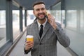 Businessman talking on the phone at train station platform Royalty Free Stock Photo