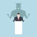 Businessman talking on podium with shadow of devil. Royalty Free Stock Photo