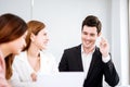 Businessman talking and smiling.Young team of coworkers making great business discussion in modern office.Teamwork people concept.