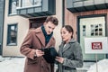 Businessman talking to real estate agent standing outside house Royalty Free Stock Photo