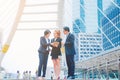 Businessman and team work.She play smart phone and talking on walkway.He holding coffee cup and talking Business. Royalty Free Stock Photo