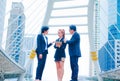 Businessman and team work.She play smart phone and talking on walkway.He holding coffee cup and talking Business. Royalty Free Stock Photo